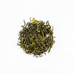 Ganesha Green - Organic Green Tea by Nepal Tea in a bag, featuring green tea leaves and packaging design.