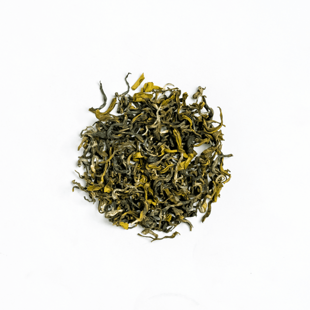 Ganesha Green - Organic Green Tea by Nepal Tea in a bag, featuring green tea leaves and packaging design.