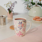 Pinky Up Bailey: Botanical Bliss Ceramic Tea Mug & Infuser, featuring a floral design and infuser for loose tea brewing.