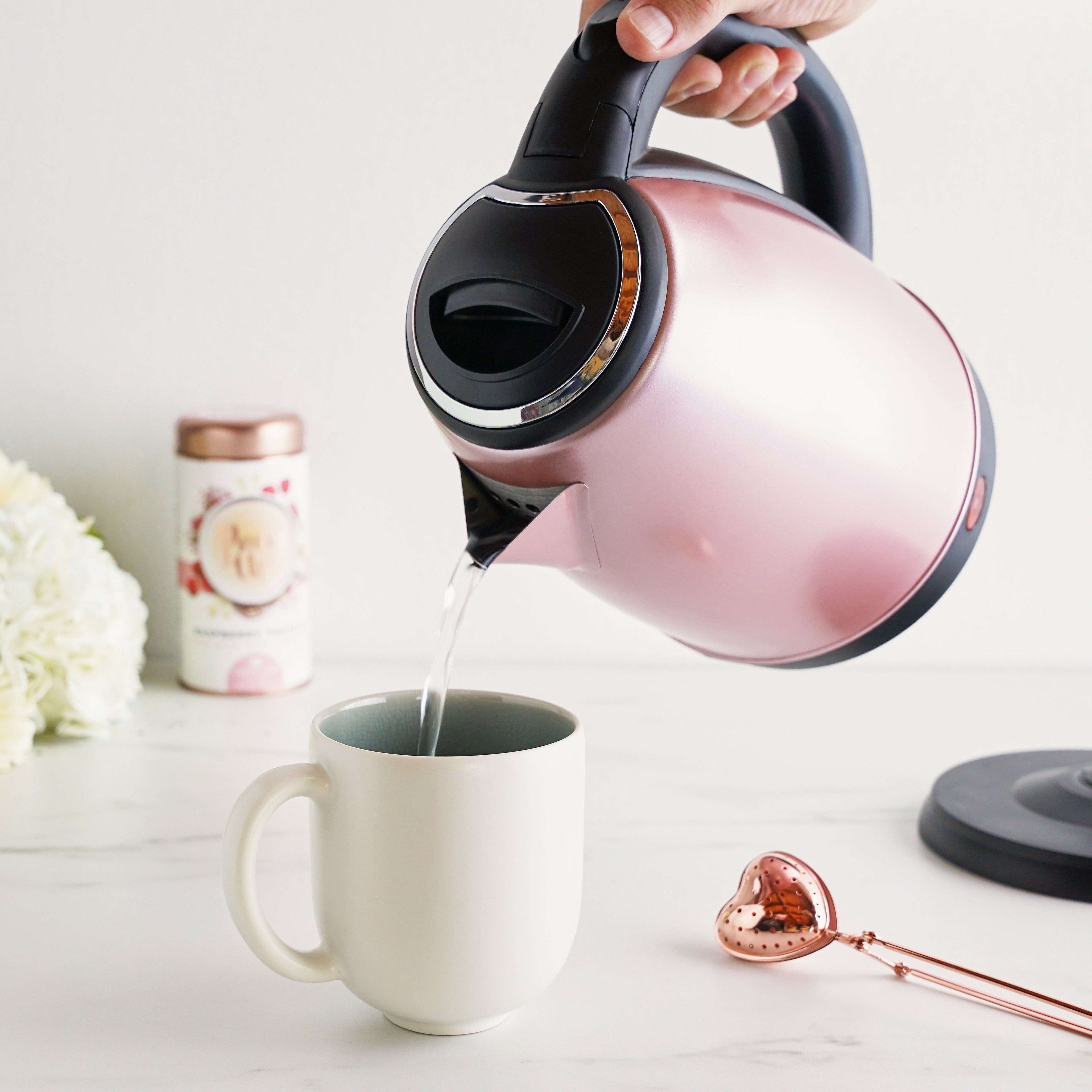 Pinky Up Parker Rose Gold Electric Tea Kettle with a sleek design, showcasing the kettle's rose gold finish.