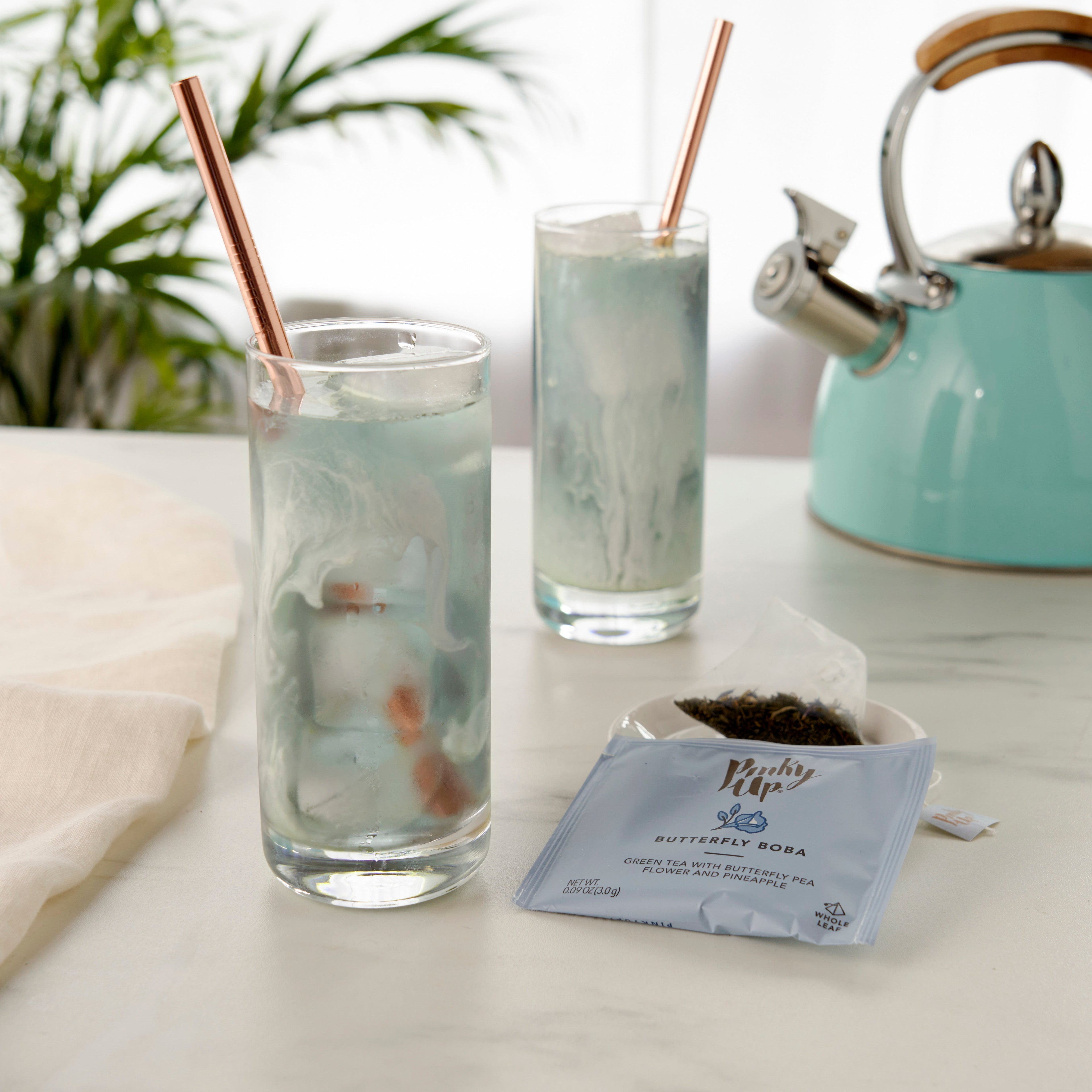 Pinky Up Butterfly Boba Tea Sachets in packaging, featuring colorful butterfly designs for brewing boba tea.