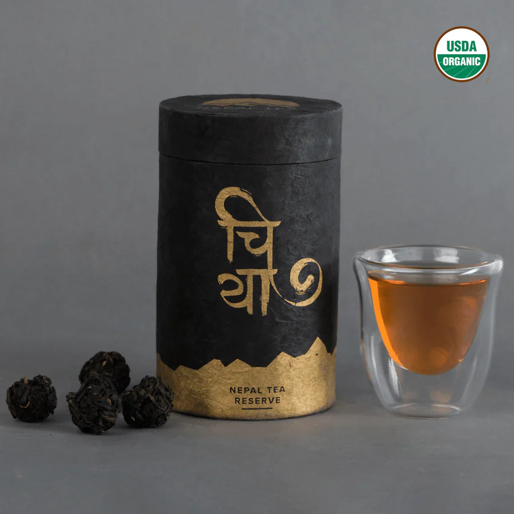KTE Summer Bloom (Matyangra) tea leaves by Nepal Tea in a detailed display, showcasing their vibrant color and texture.