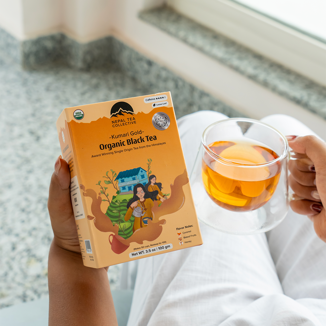 Kumari Gold tea from Nepal Tea, displayed in a clear packaging with vibrant colors and branding elements.