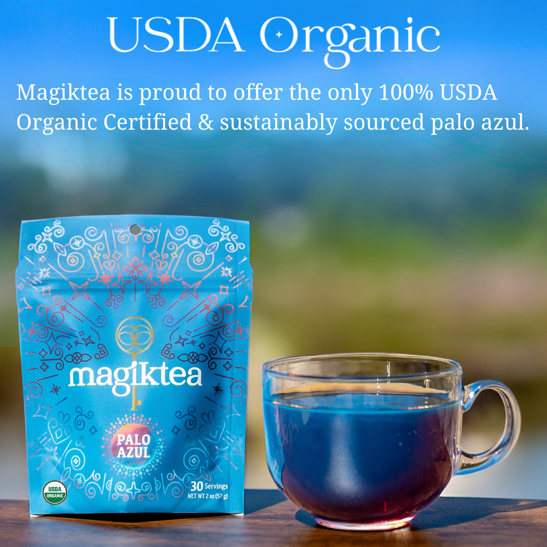 Magiktea USDA Organic Palo Azul tea package with a cup of tea on a blurred natural background