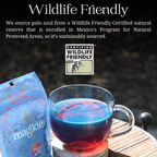 Tea bag and cup of tea with 'Certified Wildlife Friendly' label on a natural background