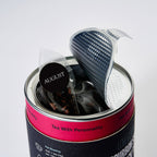 August Psychocandy - Roasted Pumpkin Caramel Rooibos Tea (Caffeine Free) in prototype packaging with open lid and tea bags visible.