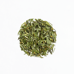 Organic Lemongrass by Nepal Tea, a bundle of fresh lemongrass stalks displayed against a neutral background.