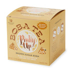 Pinky Up Brown Sugar Boba Tea Sachets in a pyramid shape, featuring black tea, tapioca pearls, and coconut milk powder.