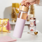 Pinky Up Dana Glass Travel Mug in Lavender, a glass travel mug with a lavender design and lid, ideal for on-the-go beverages.