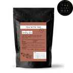 Tea with Tae Rooibos Chai Pouch, a red tea blend in a sealed pouch, shown against a plain background.