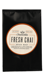 Chai Spice Dust by Somage USA in a clear container, showcasing a blend of spices for chai tea preparation.