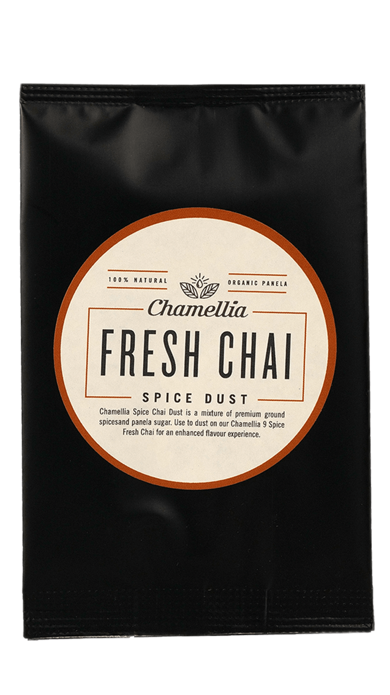 Chai Spice Dust by Somage USA in a clear container, showcasing a blend of spices for chai tea preparation.