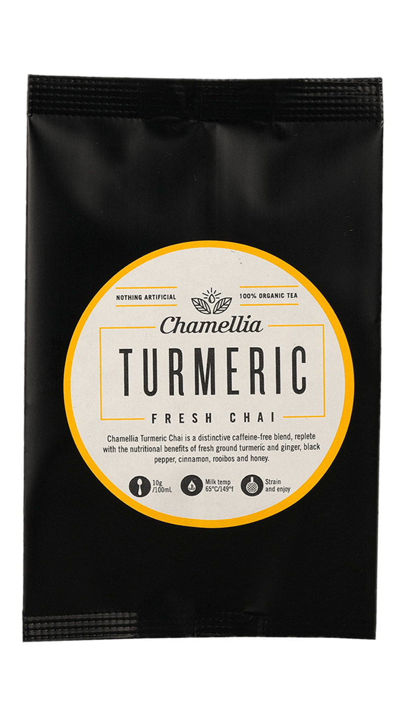 Turmeric Fresh Chai by Somage USA in a cup, showcasing its vibrant yellow color and fragrant spices.