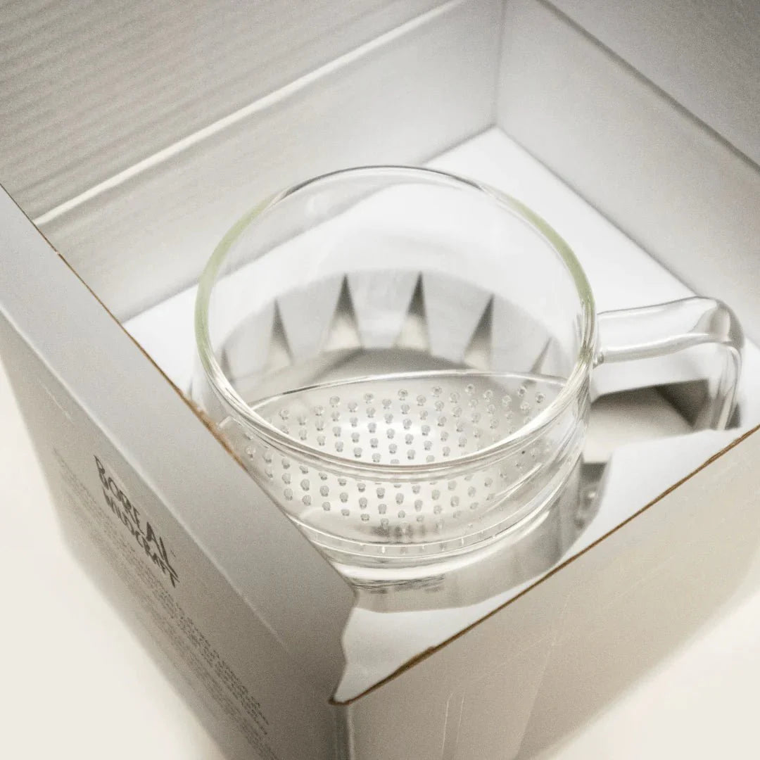 Sampler Box + WALL Tea Infuser by Nepal Tea, featuring a selection of tea samples and a wall-mounted infuser.