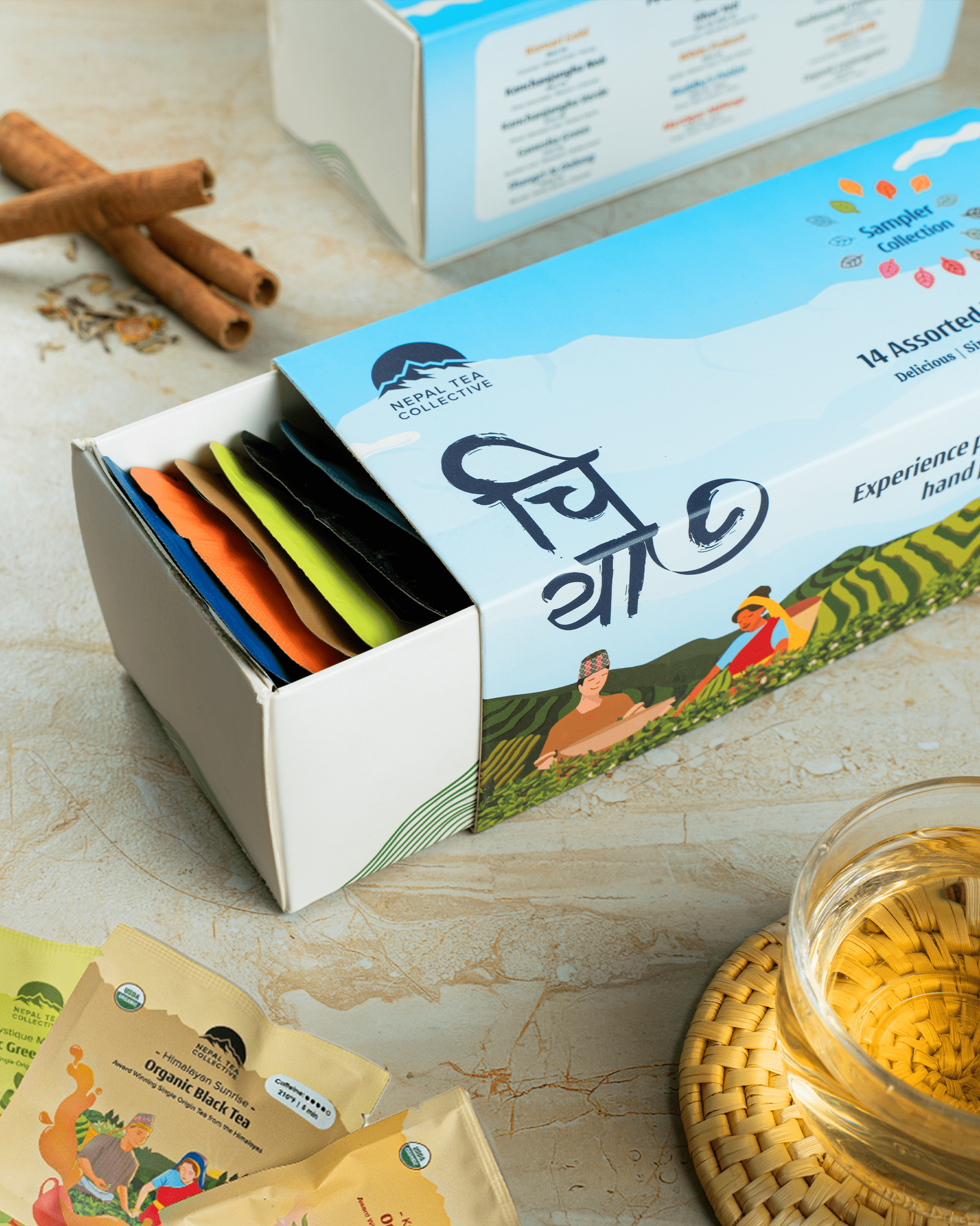 Nepal Tea Sampler Collection by Nepal Tea, featuring assorted tea samples in individual packets on a display.
