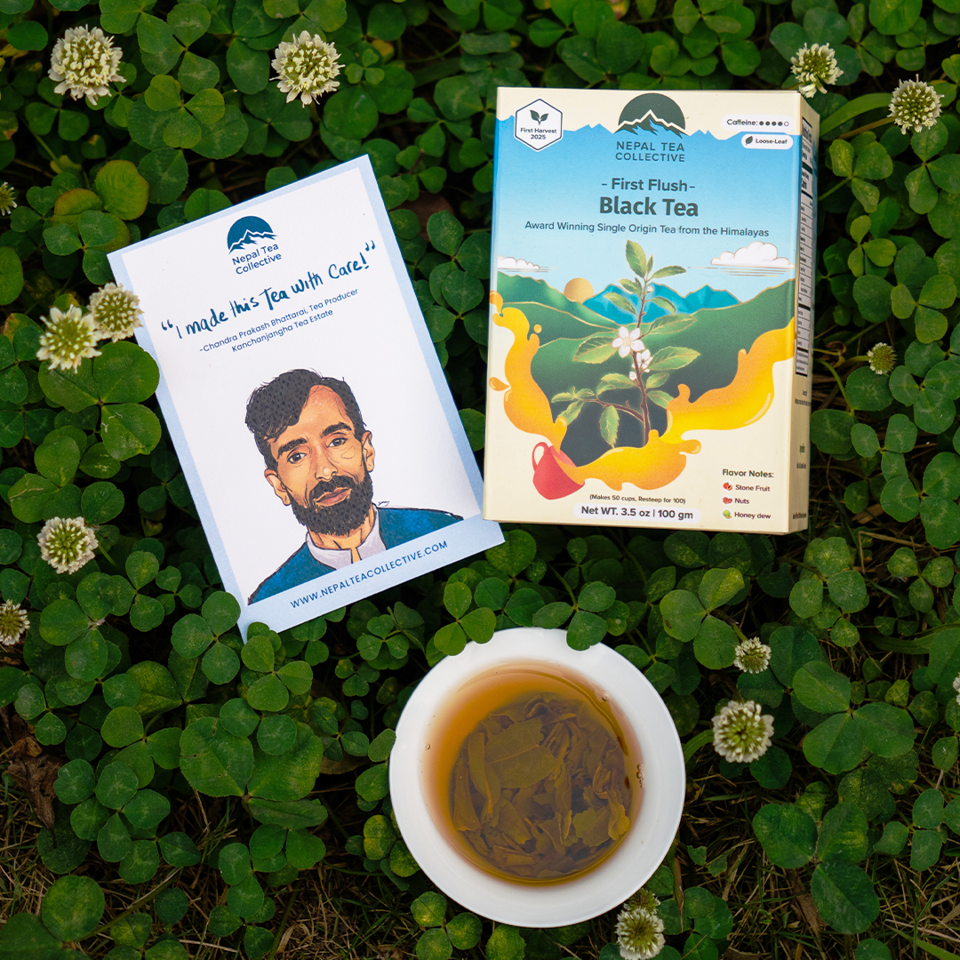 First Flush Black Tea by Nepal Tea displayed in a tea package with loose tea leaves in the background.