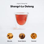 Shangri-La Oolong by Nepal Tea, featuring loose tea leaves in a natural setting