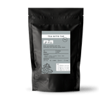 Tea with Tae Spa Bliss Pouch displayed in a clear bag, containing herbal tea ingredients for relaxation and wellness.
