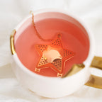 Pinky Up Star Shaped Tea Infuser, a star-shaped stainless steel tea infuser for steeping loose tea, displayed on a white background.
