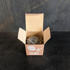 Piper and Leaf Piper Tea Ball in a metal box, featuring a tea infuser with a sleek design for brewing loose leaf tea.