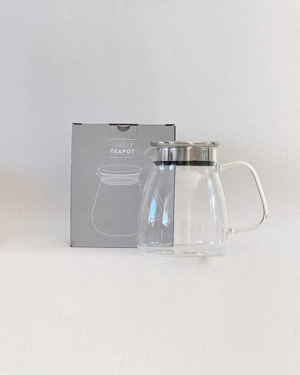 Teappo Simple Teapot by Teappo, showcasing a minimalist design with a smooth finish in an elegant teapot shape.