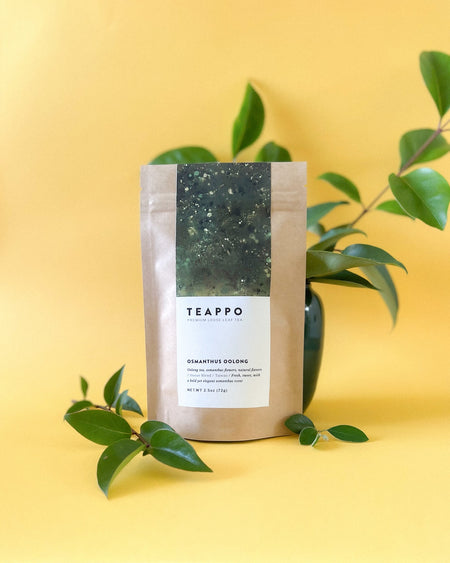 Teappo Osmanthus Oolong, 2.5 oz tea package showing vibrant yellow osmanthus flowers, suitable for hot or cold brewing.