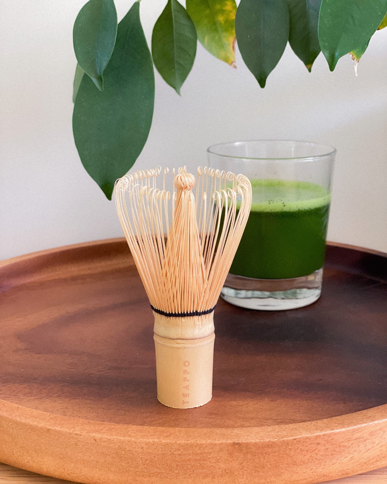 Teappo Premium Matcha Whisk shown in image, showcasing its bamboo design for preparing matcha tea