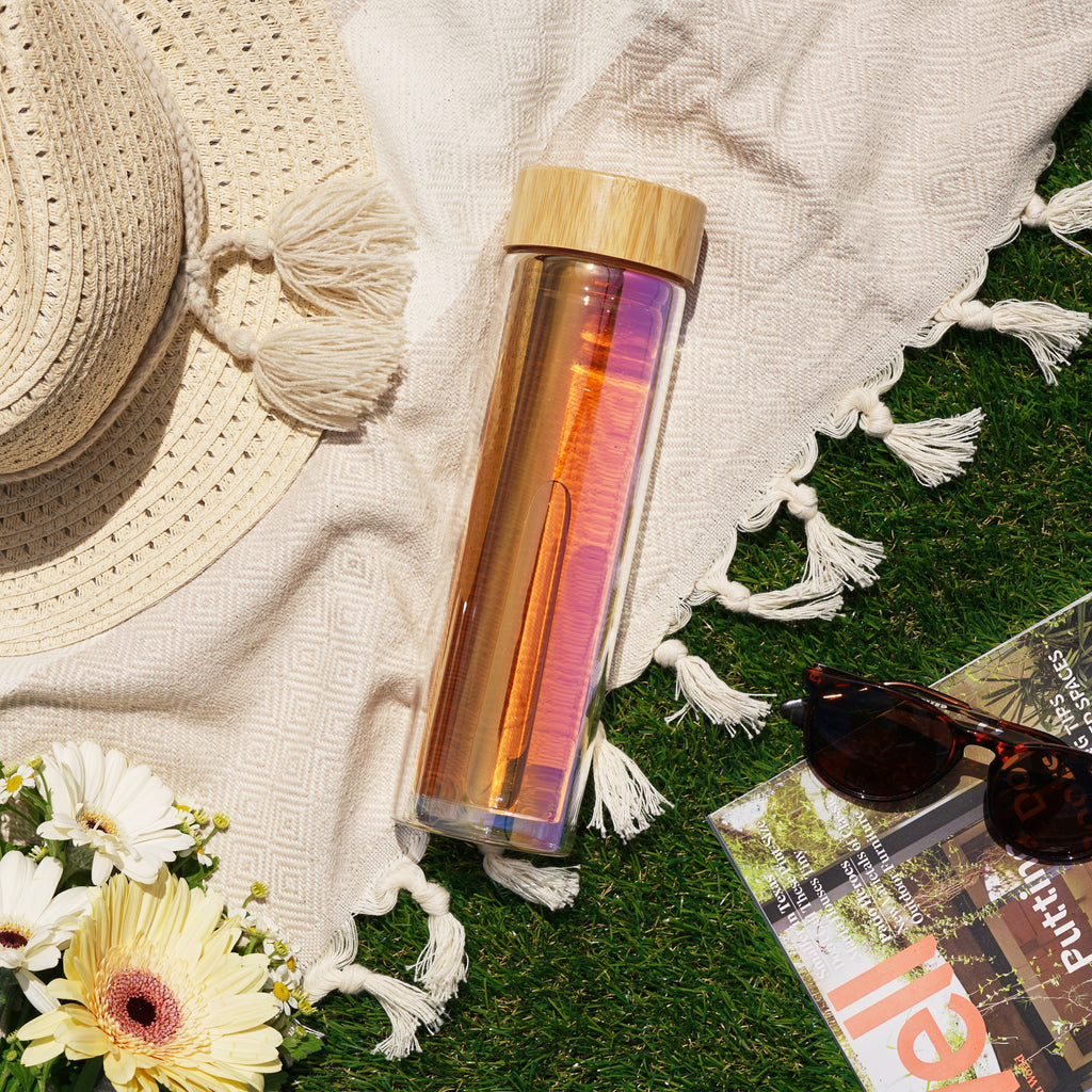 Iridescent glass travel infuser mug by Pinky Up, featuring a pink lid and infuser for loose leaf tea.