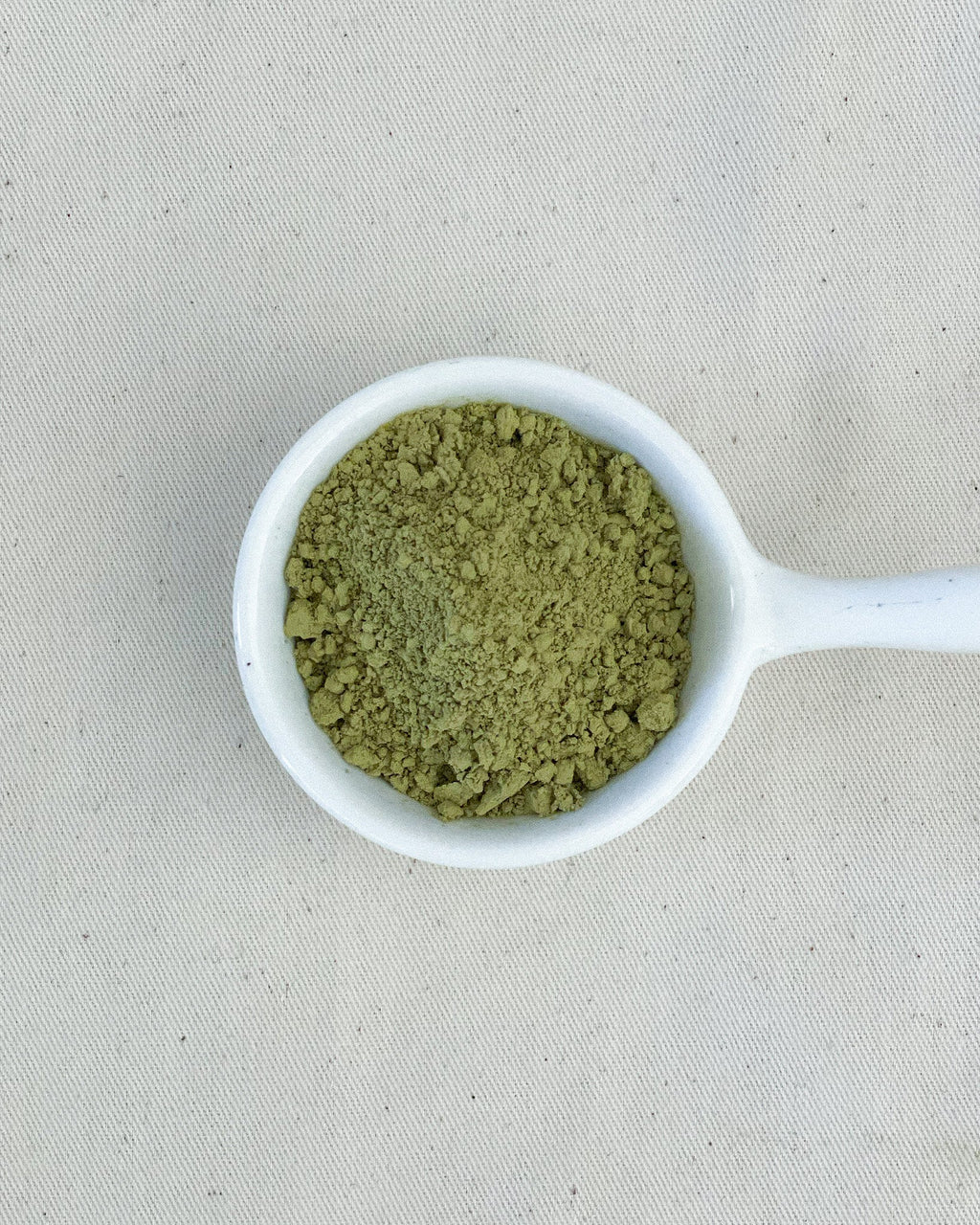 Teappo Yuzu Oolong Powder in a sealed package, showcasing the product's bright yellow powder texture.