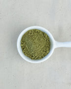 Teappo Yuzu Oolong Powder in a sealed package, showcasing the product's bright yellow powder texture.