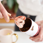 Pinky Up Rose Gold Heart Tea Infuser, a heart-shaped infuser in rose gold color for brewing loose leaf tea.
